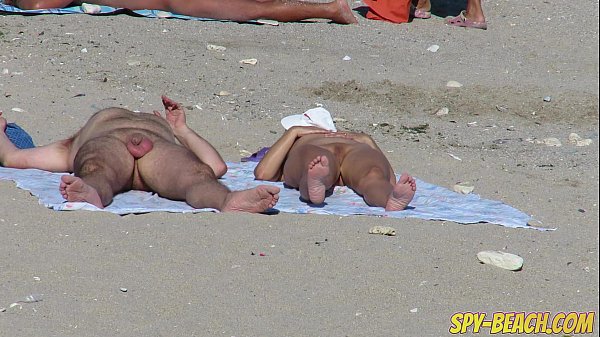 Busty sexy chicks group on nudist beach scene