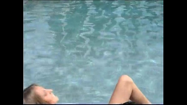 Teenager masturbation next to poolside scene