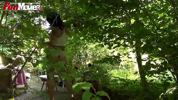 Mature masturbating in backyard scene