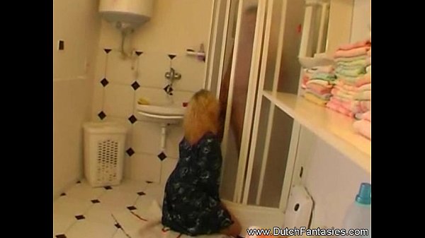 Brother cutting sister clothes in bathroom scene